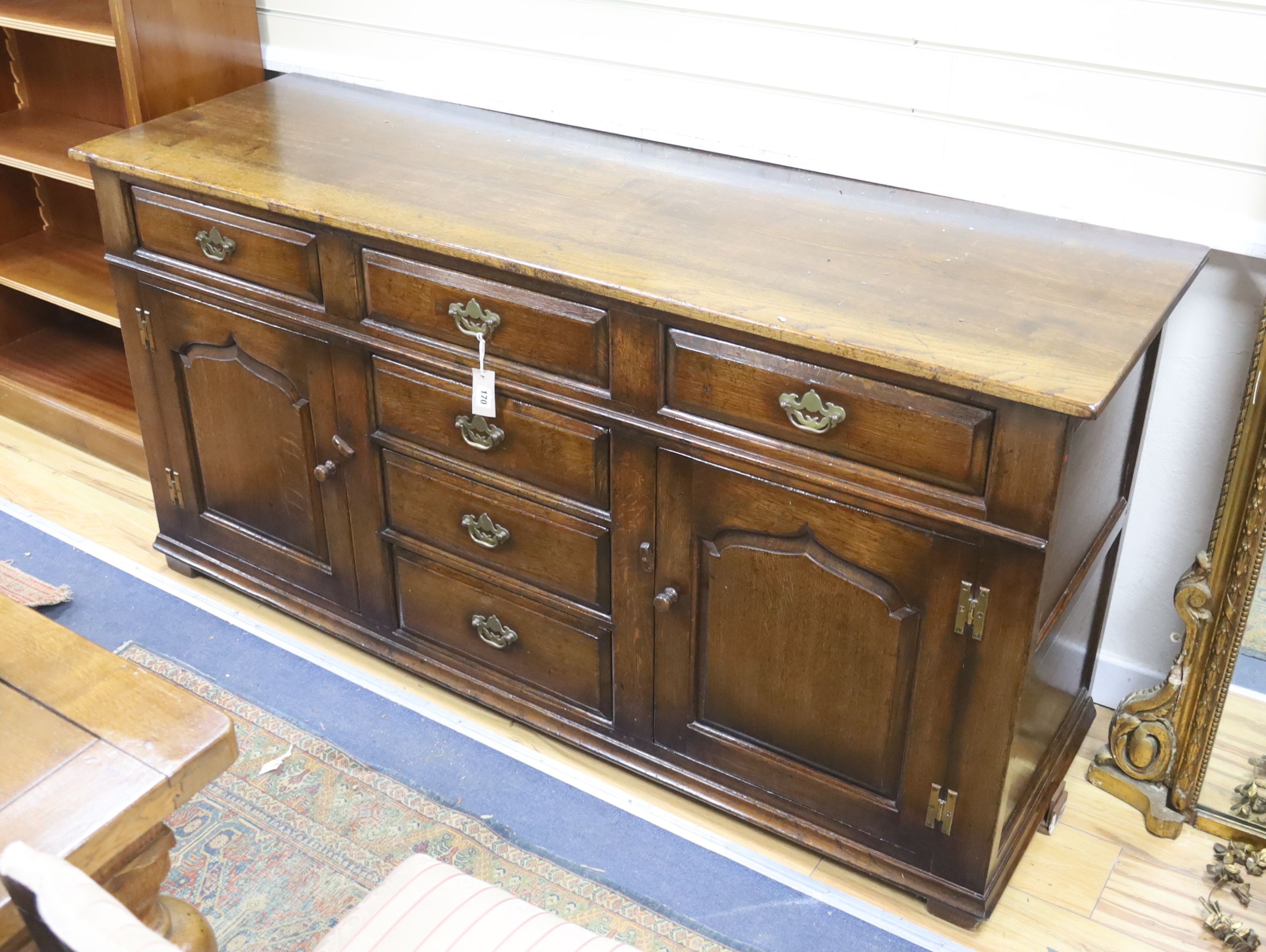 An 18th century style oak low dresser, length 168cm, depth 53cm, height 83cm